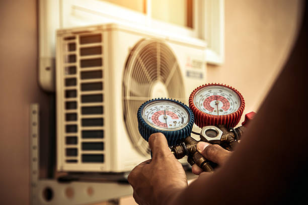 Professional Air Conditioning Service technician working in Cane Valley, KY